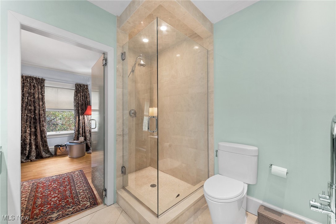 2890 Lee Road Cleveland, OH 44120 - Photo 26 of 48 Owners suite bathroom with walk in shower, lime stone flooring