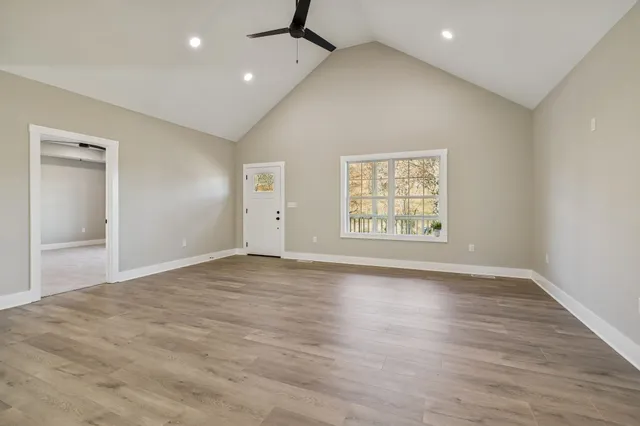 a kitchen with stainless steel appliances granite countertop a sink refrigerator and cabinets