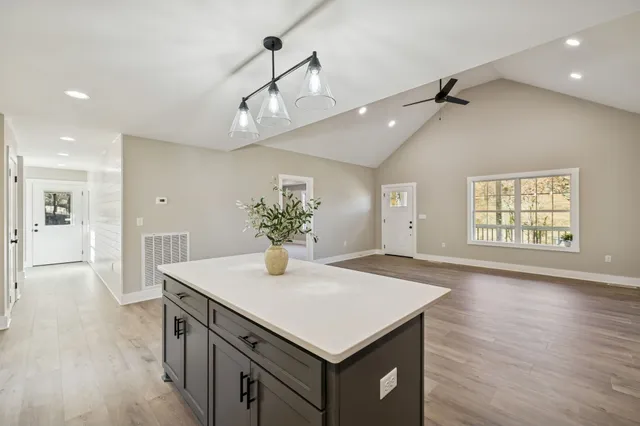 a bathroom with a double vanity sink toilet and shower