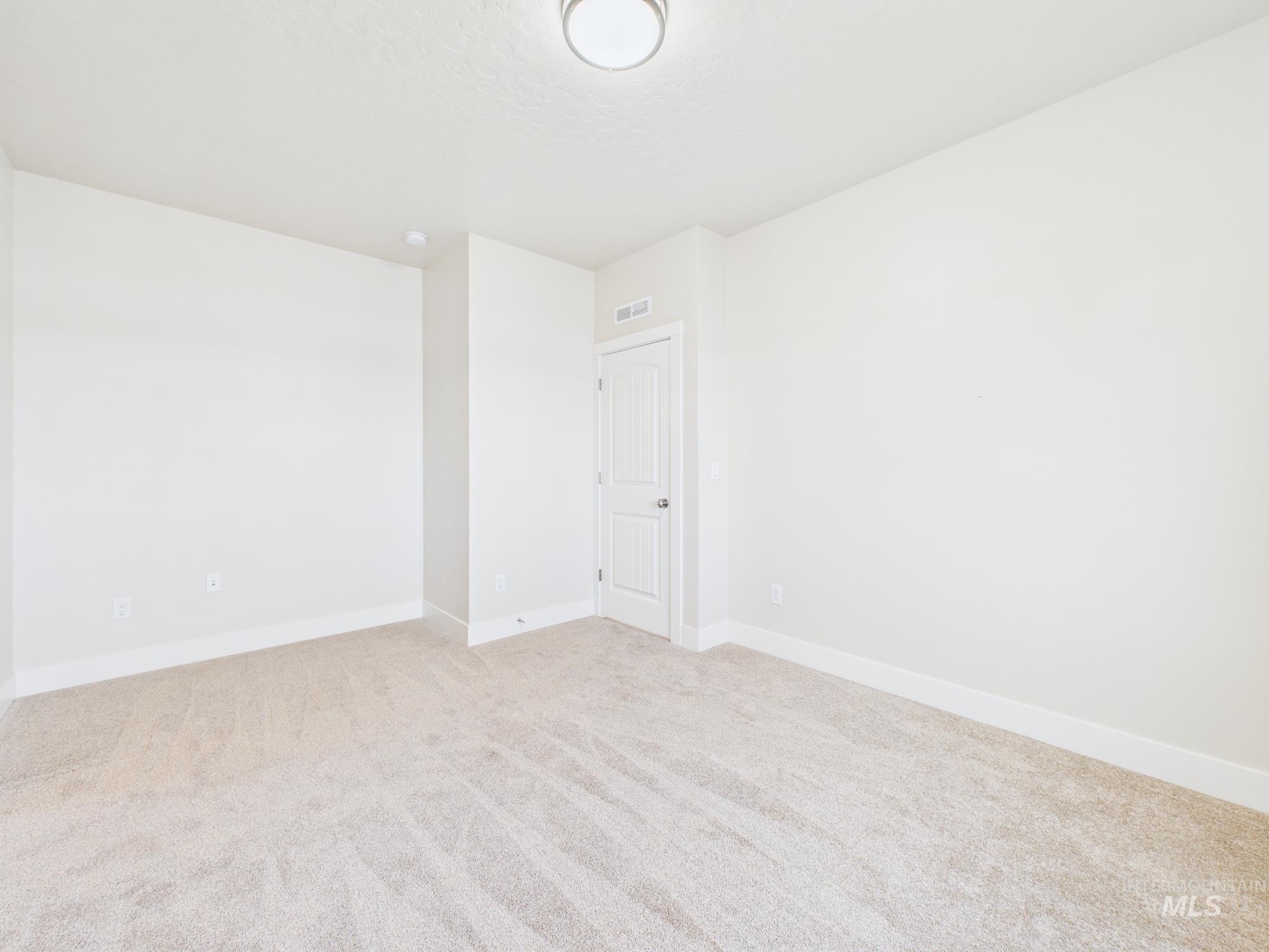 1545 Trail Way Weiser, ID 83672 - Photo 18 of 50 Unfurnished room with baseboards and light colored carpet