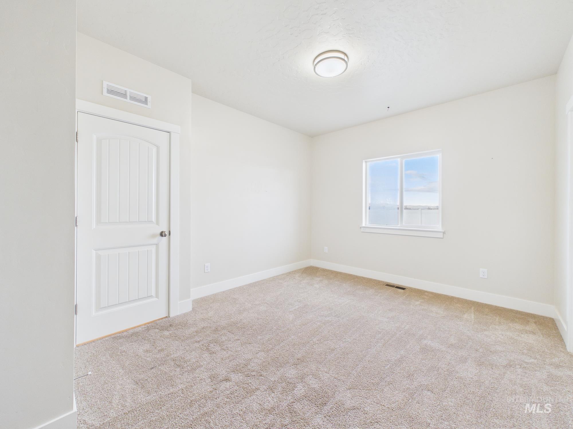 1545 Trail Way Weiser, ID 83672 - Photo 19 of 50 Empty room with baseboards and light colored carpet