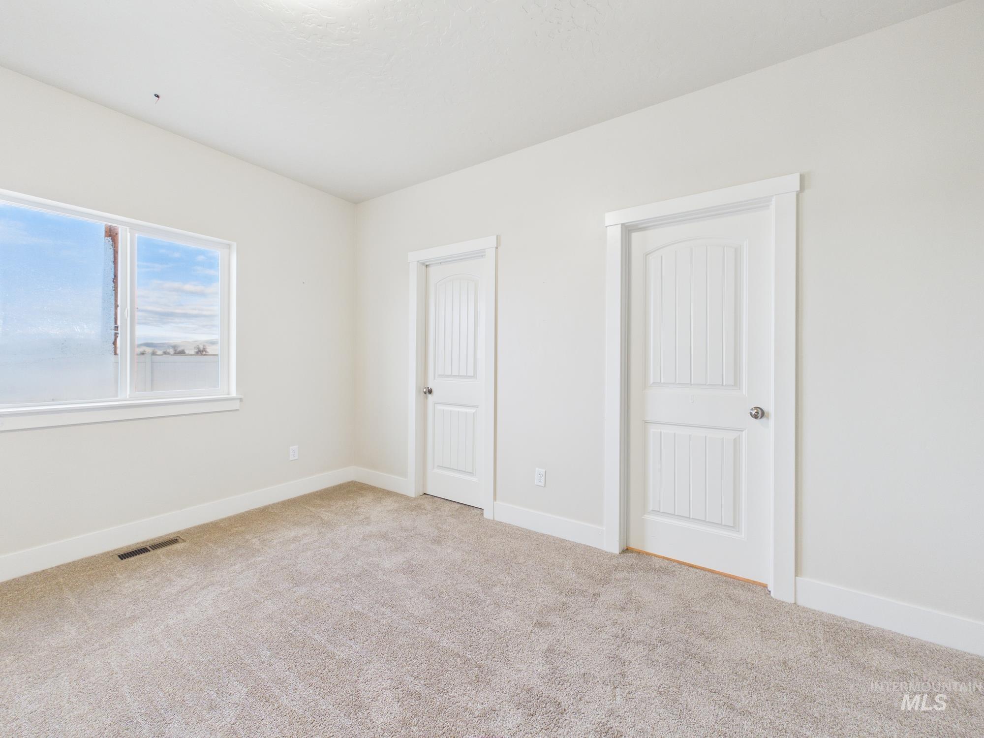 1545 Trail Way Weiser, ID 83672 - Photo 20 of 50 Unfurnished bedroom featuring baseboards and carpet flooring