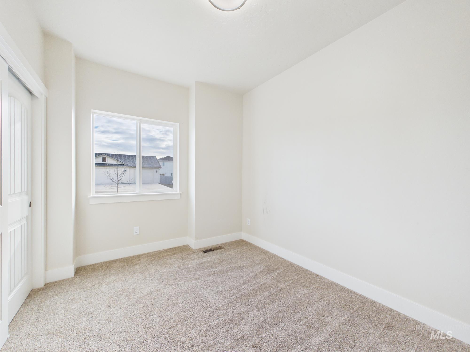 1545 Trail Way Weiser, ID 83672 - Photo 23 of 50 Unfurnished bedroom featuring a closet and light colored carpet