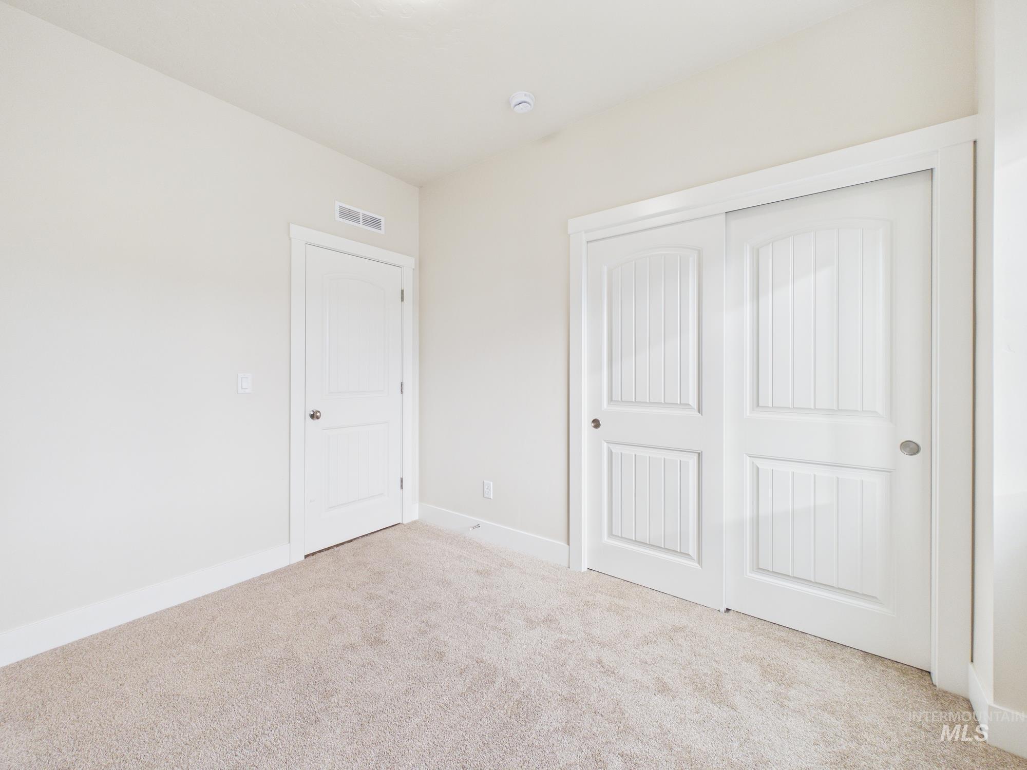 1545 Trail Way Weiser, ID 83672 - Photo 24 of 50 Unfurnished bedroom featuring carpet flooring and a closet