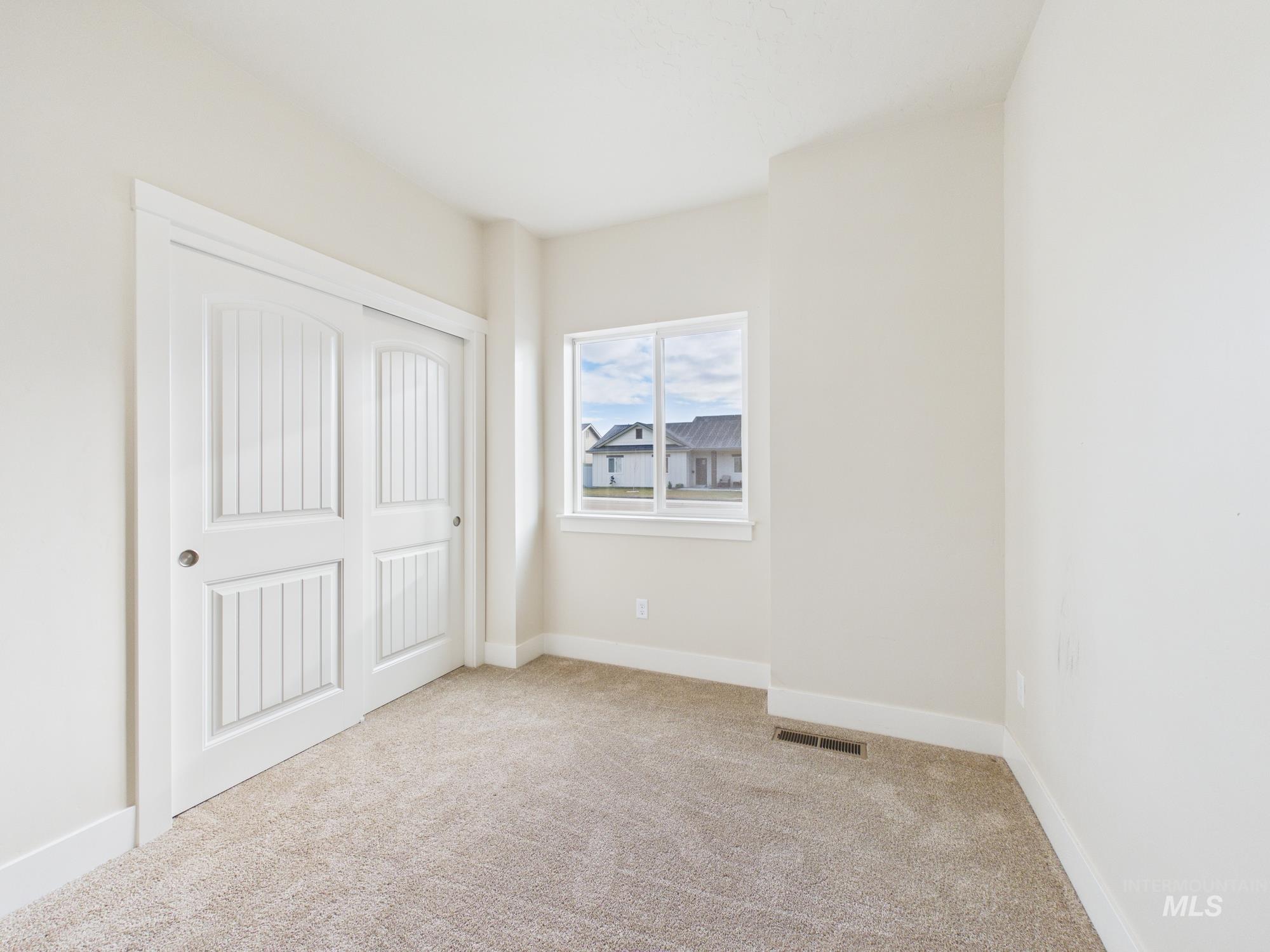 1545 Trail Way Weiser, ID 83672 - Photo 25 of 50 Unfurnished bedroom with light carpet and a closet