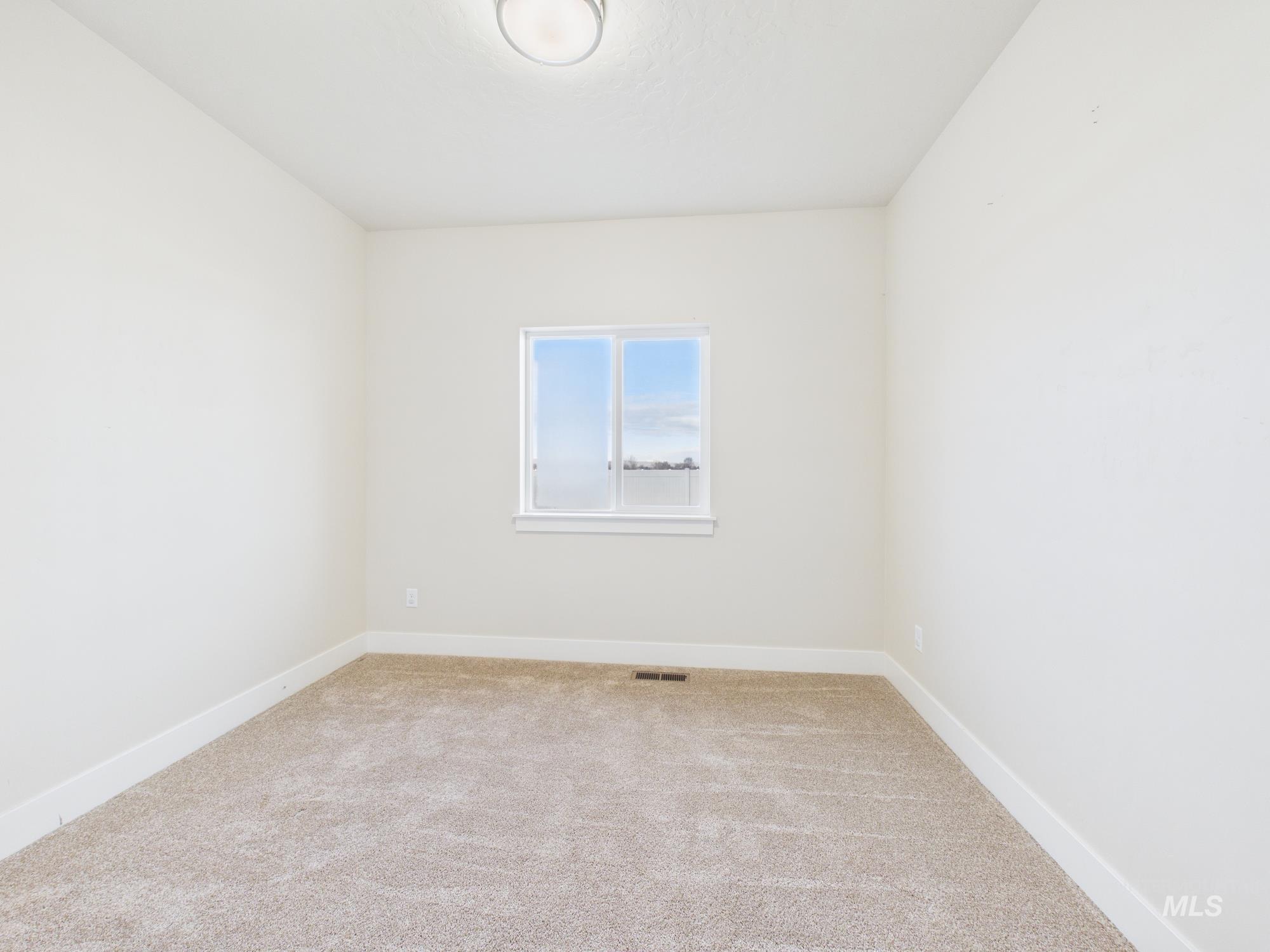 1545 Trail Way Weiser, ID 83672 - Photo 28 of 50 Empty room featuring baseboards and light carpet