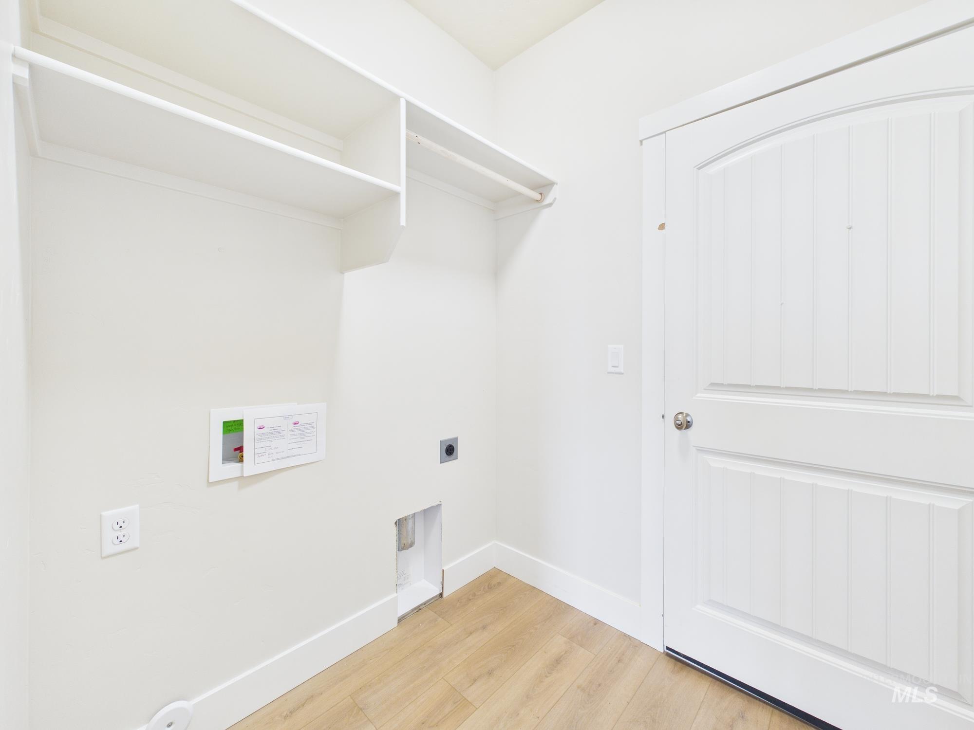 1545 Trail Way Weiser, ID 83672 - Photo 31 of 50 Laundry area featuring light wood-type flooring, hookup for an electric dryer, and washer hookup