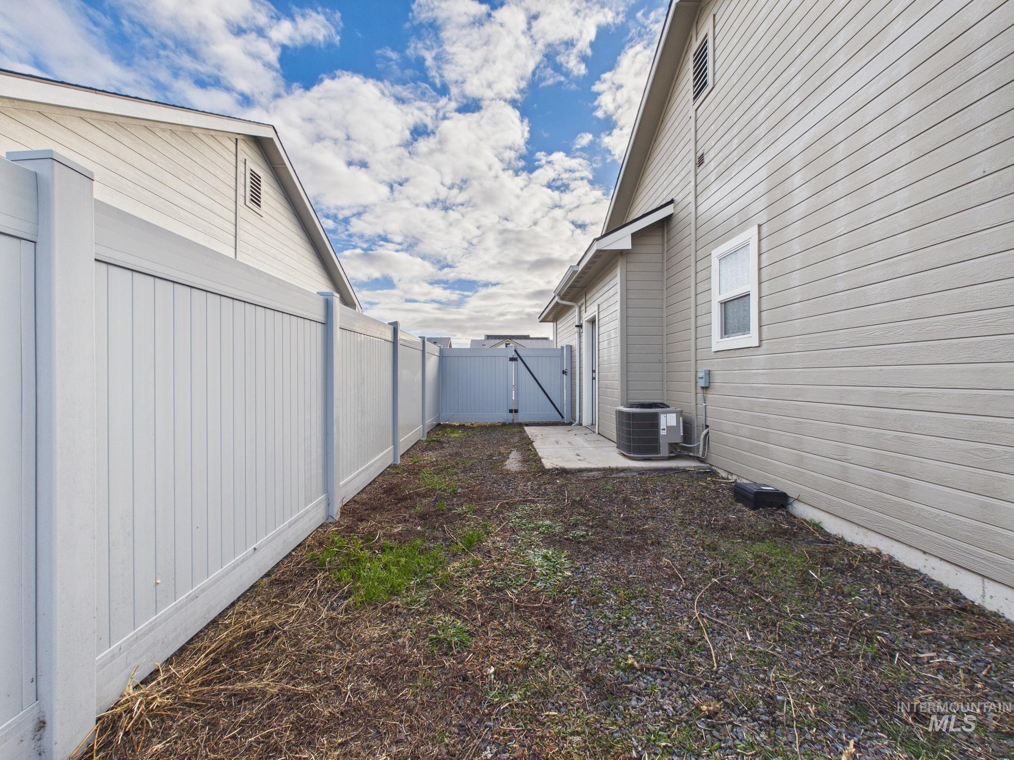 1545 Trail Way Weiser, ID 83672 - Photo 37 of 50 Fenced backyard featuring a gate and a patio area