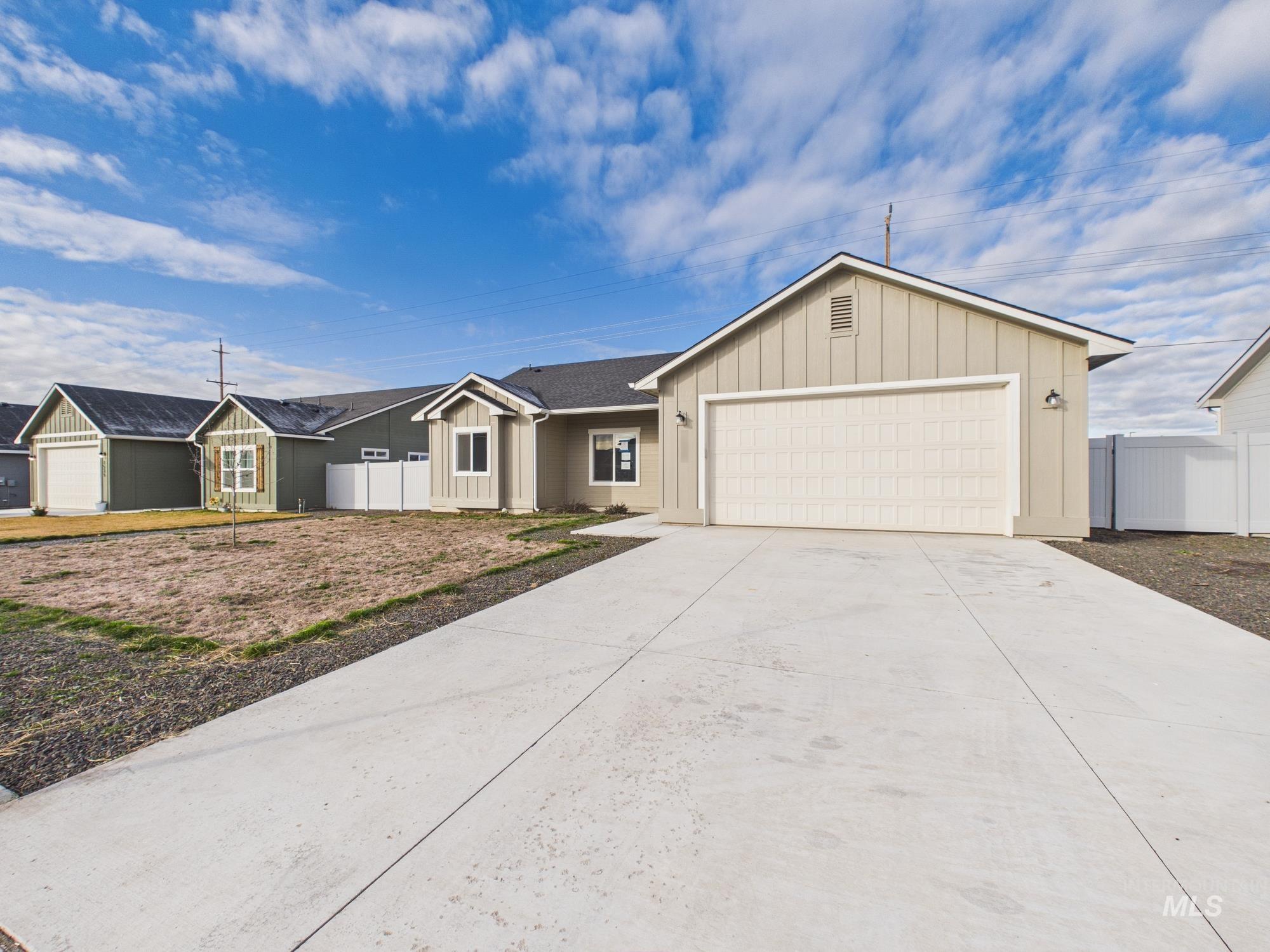 1545 Trail Way Weiser, ID 83672 - Photo 44 of 50 Ranch-style home featuring board and batten siding, a garage, and driveway