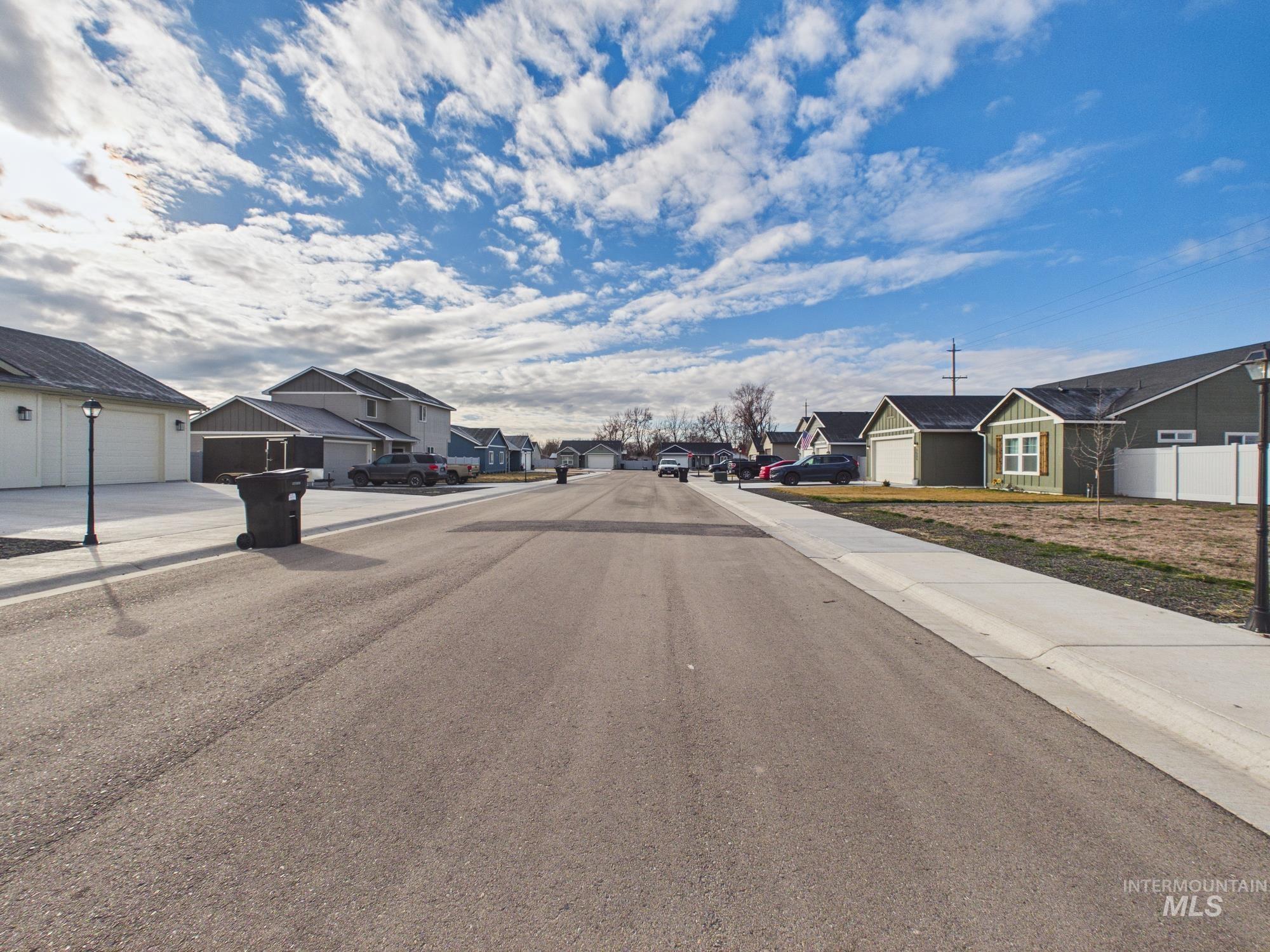 1545 Trail Way Weiser, ID 83672 - Photo 48 of 50 View of asphalt street featuring sidewalks, a residential view, and curbs