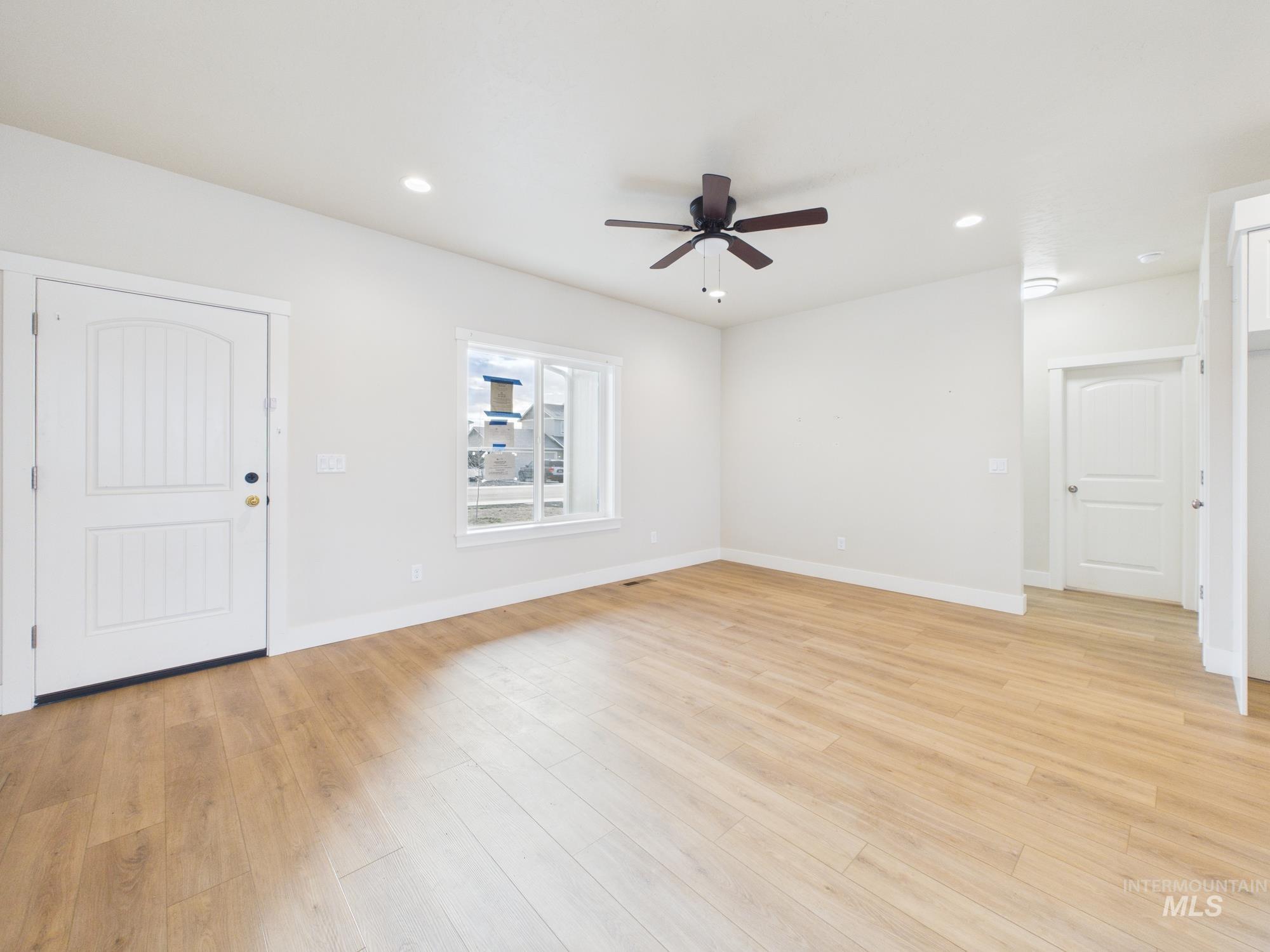 1545 Trail Way Weiser, ID 83672 - Photo 5 of 50 Foyer entrance with light wood-style floors, a ceiling fan, and recessed lighting