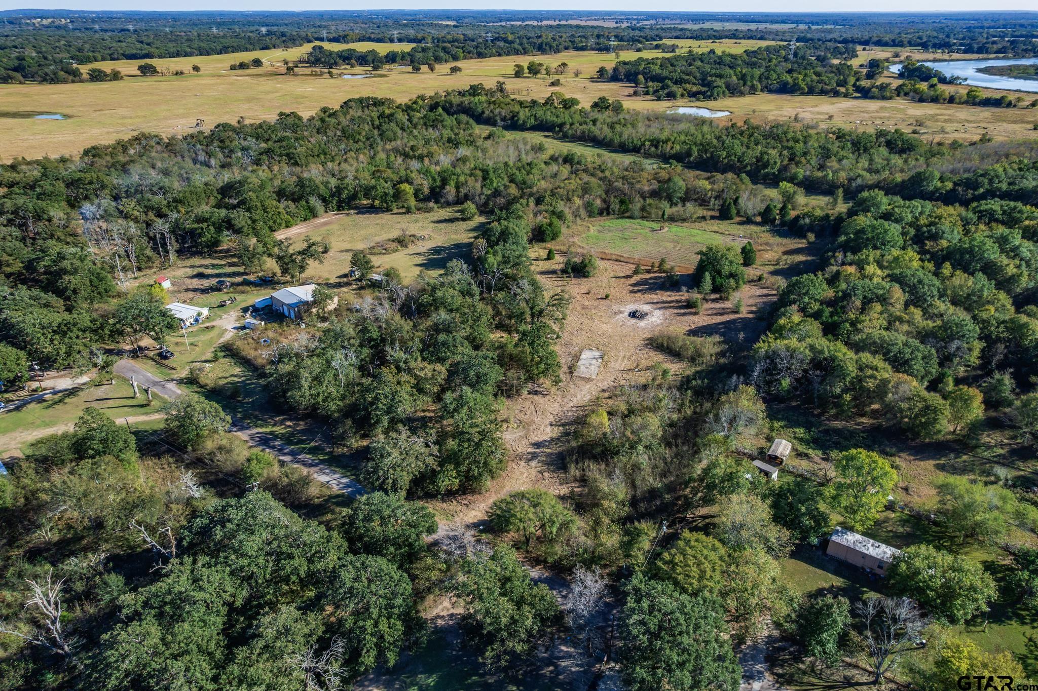 Tbd Tempie Road Trinidad, TX 75163 - Photo 3 of 20 an aerial view of green landscape with trees houses and lake view