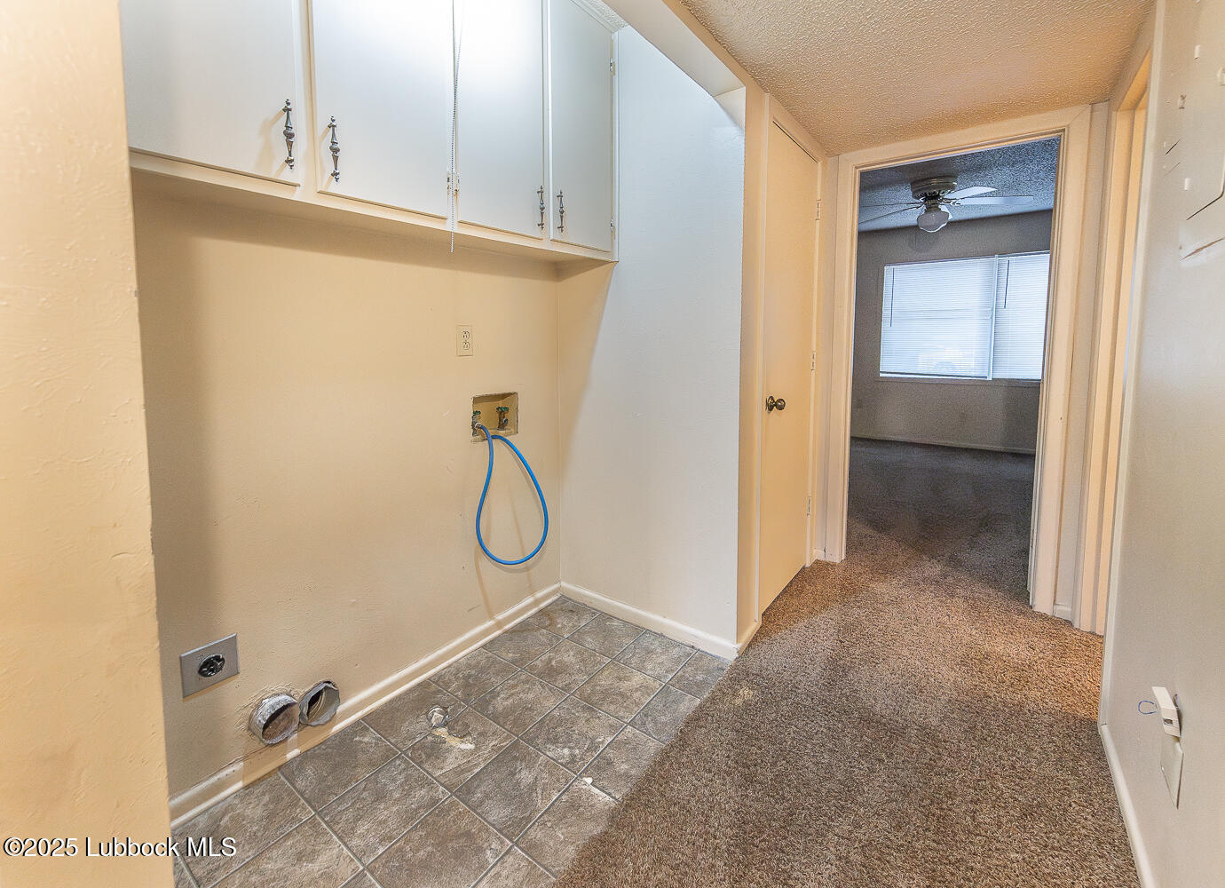 5750 38th Street Lubbock, TX 79407 - Photo 11 of 24 a bathroom with a granite countertop sink and a mirror
