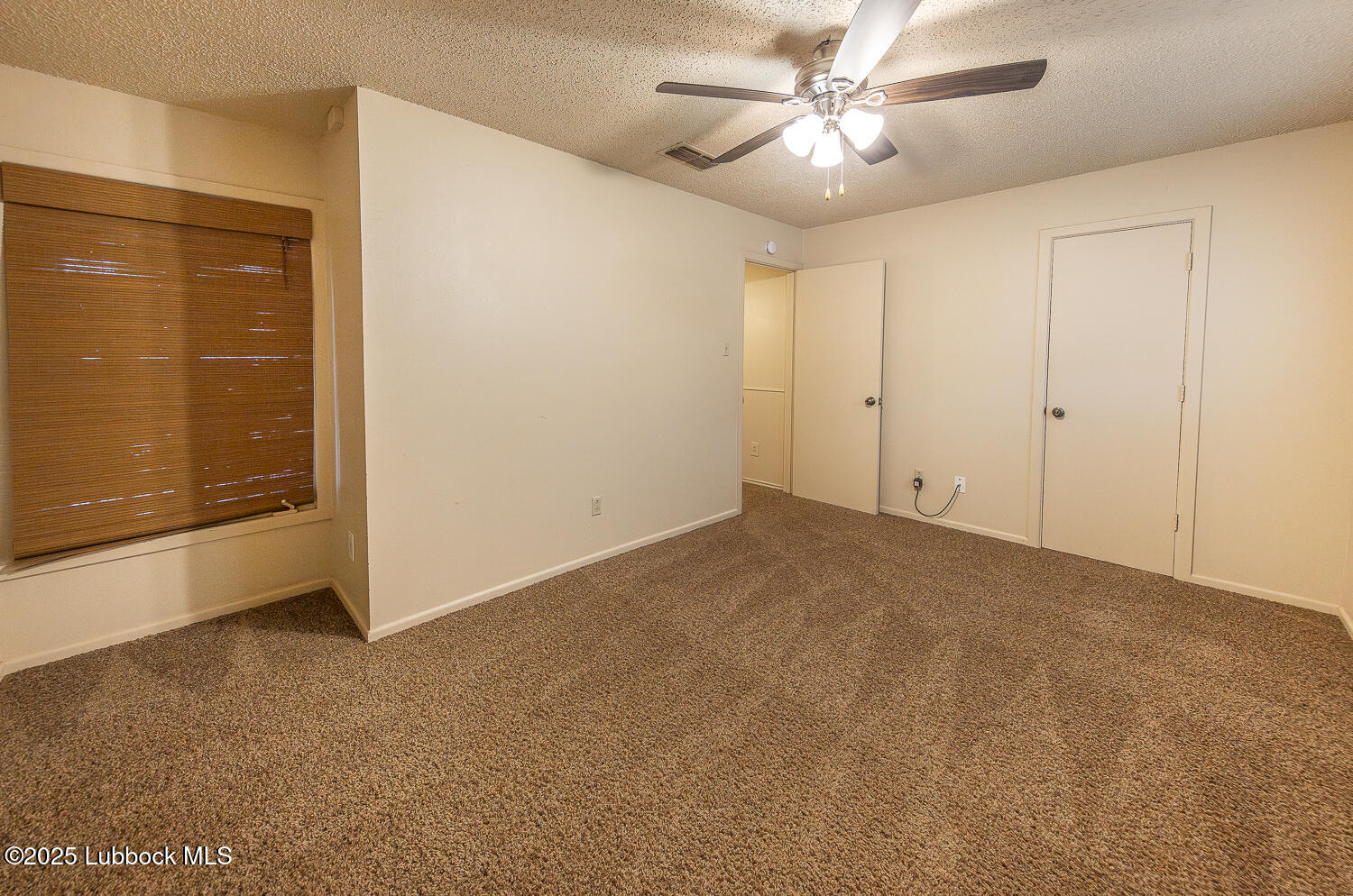 5750 38th Street Lubbock, TX 79407 - Photo 20 of 24 a view of an empty room and window