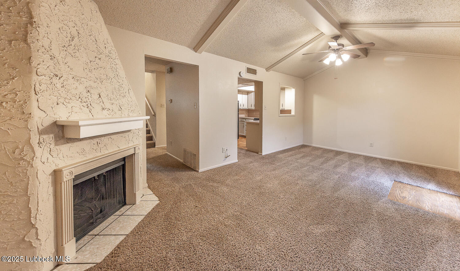 5750 38th Street Lubbock, TX 79407 - Photo 2 of 24 a view of a livingroom with a fireplace