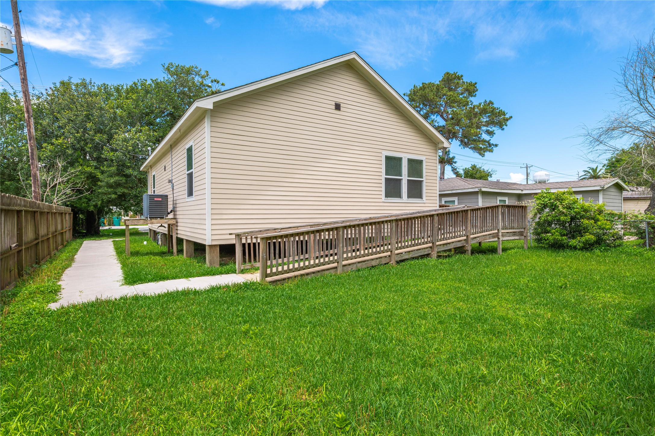 1125 Lake Road La Marque, TX 77568 - Photo 24 of 33 a view of a house with a yard and sitting area