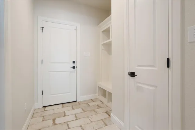 a view of bathroom with white walls