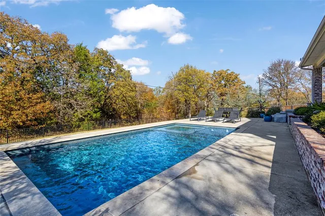 a view of outdoor space swimming pool and trees