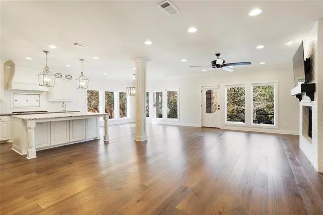 a view of kitchen with cabinets and wooden floor