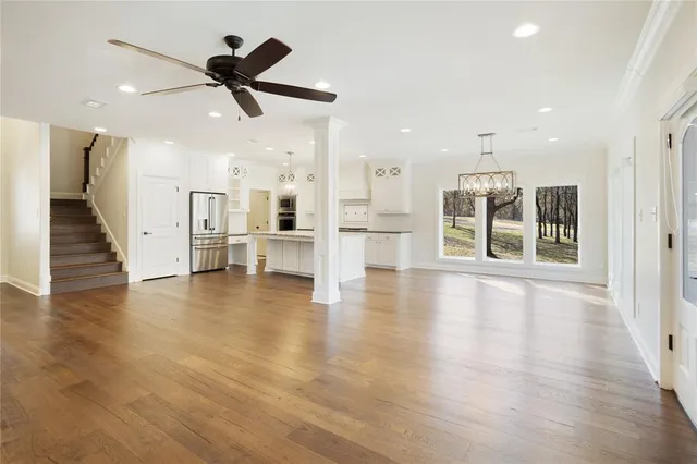 a view of a living room and wooden floor