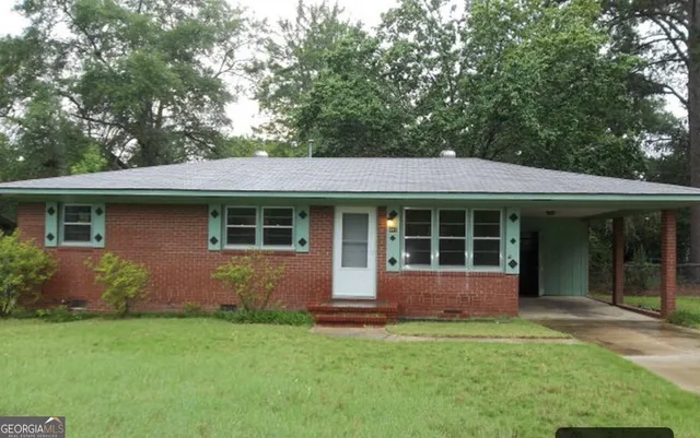 front view of a house with a yard