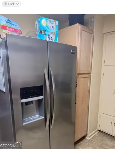 a close view of refrigerator and stove