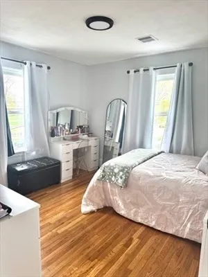 a bedroom with a bed and a dresser