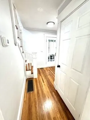 a view of a living room with a fireplace