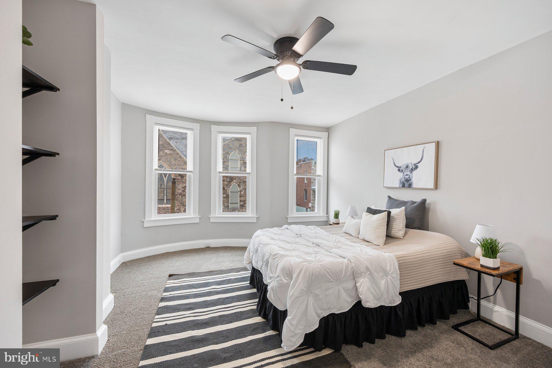 3611 Chestnut Avenue Baltimore, MD 21211 - Photo 21 of 38 a bedroom with bed and a window