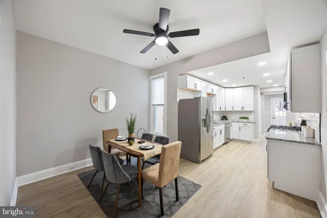 a dining room with furniture and window