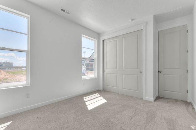 3204 West 1570 North Provo, UT 84601 - Photo 8 of 19 Unfurnished bedroom featuring light colored carpet and a closet
