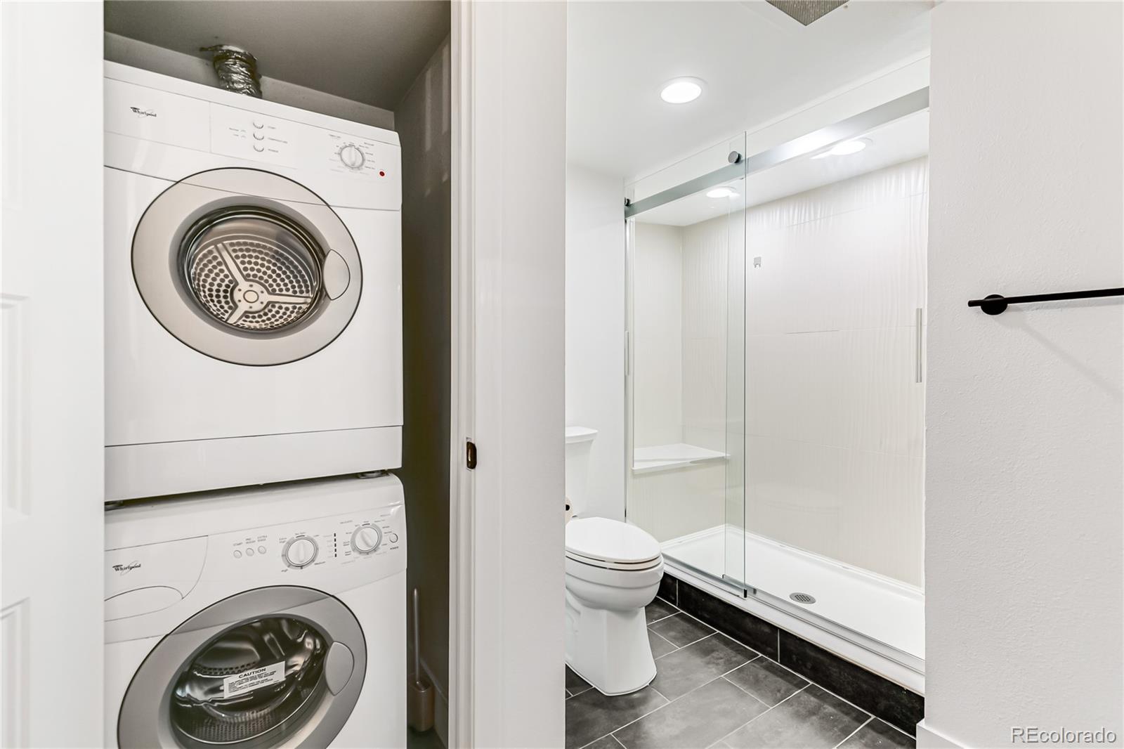 350 Detroit Street, Unit 413 Denver, CO 80206 - Photo 15 of 25 a view of bathroom with a washer and dryer