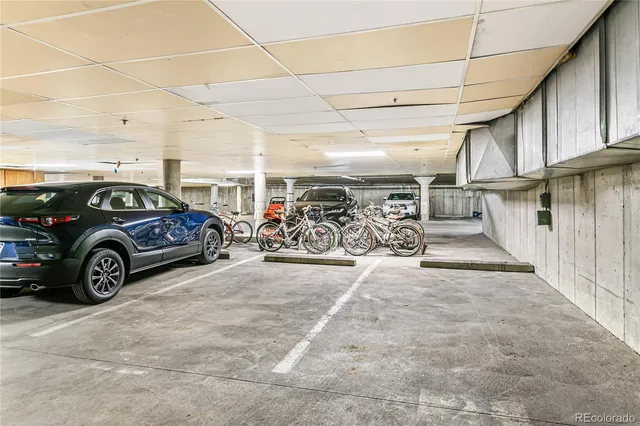 a view of a garage with parked cars