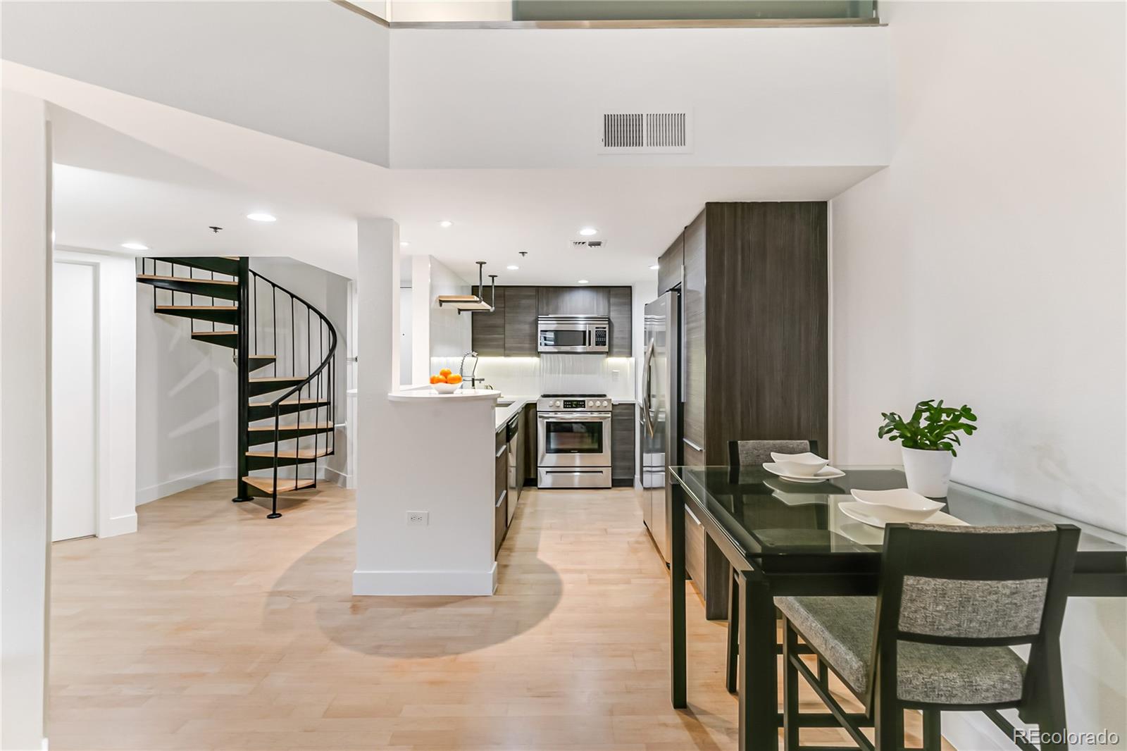 350 Detroit Street, Unit 413 Denver, CO 80206 - Photo 8 of 25 a living room with furniture and wooden floor