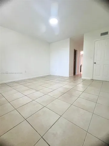 a view of an empty room and window