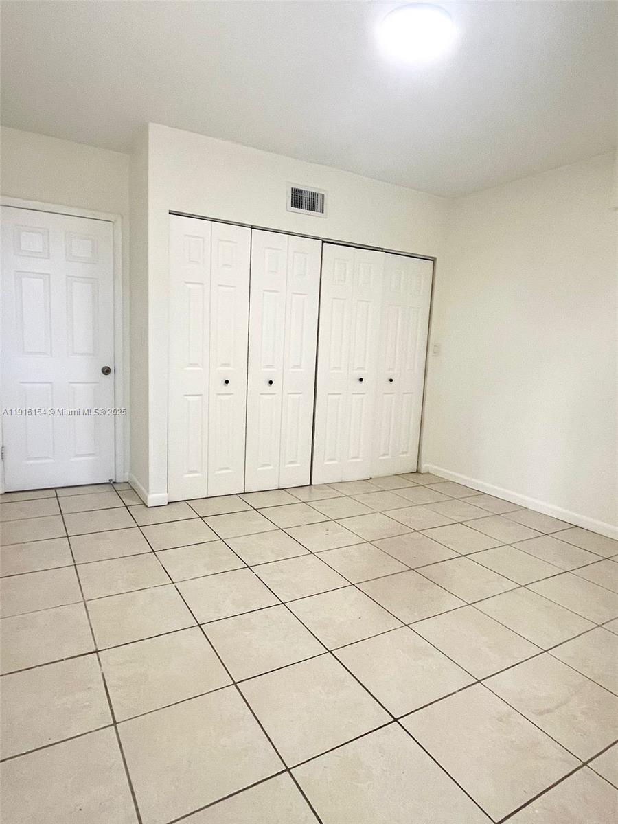 800 Northeast 199th Street, Unit 106D Miami, FL 33179 - Photo 9 of 20 a view of a room & utility room