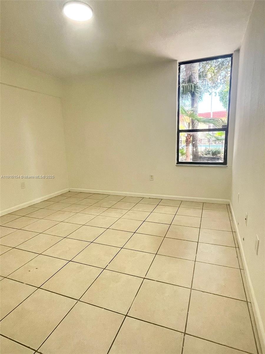 800 Northeast 199th Street, Unit 106D Miami, FL 33179 - Photo 10 of 20 a view of a room & utility room
