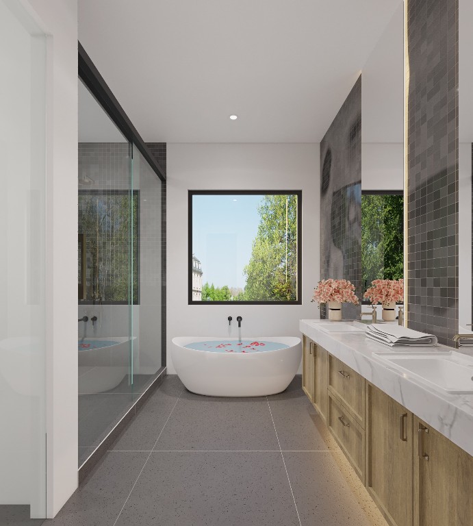 6210 Camino Real Austin, TX 78757 - Photo 14 of 19 a bathroom with a double vanity sink a mirror and a bathtub