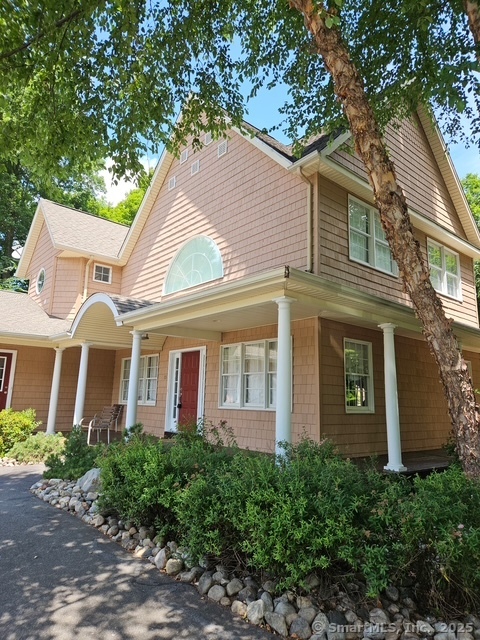 a view of a white building among the top of house