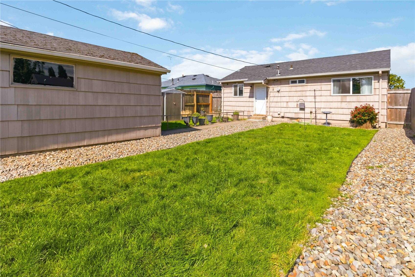 356 28th Avenue Longview, WA 98632 - Photo 21 of 24 a view of a backyard with plants and large tree