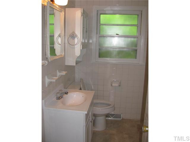 222 Forestville Road Wake Forest, NC 27587 - Photo 11 of 18 a bathroom with a sink and a vanity