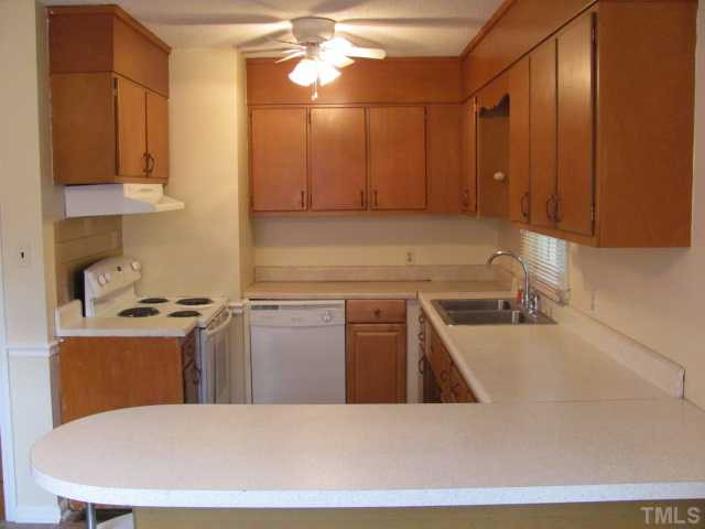 222 Forestville Road Wake Forest, NC 27587 - Photo 5 of 18 a kitchen with stainless steel appliances granite countertop a sink counter space cabinets and stainless steel appliances