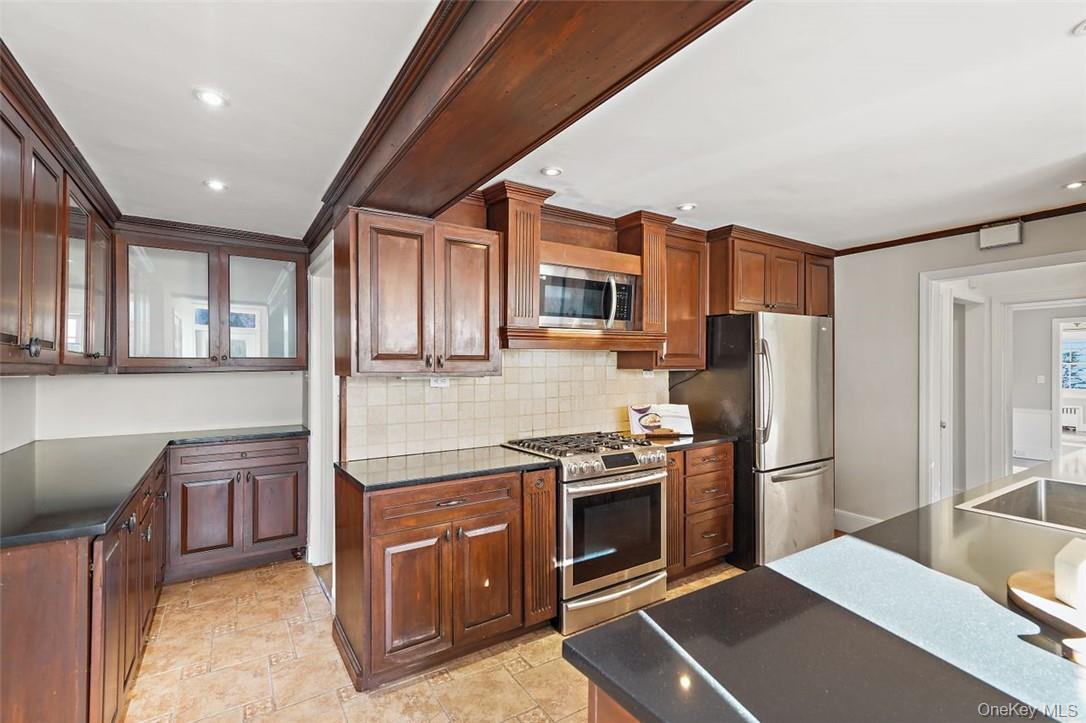 246 Mamaroneck Road Scarsdale, NY 10583 - Photo 17 of 35 Cherry wood cabinets offer abundant storage