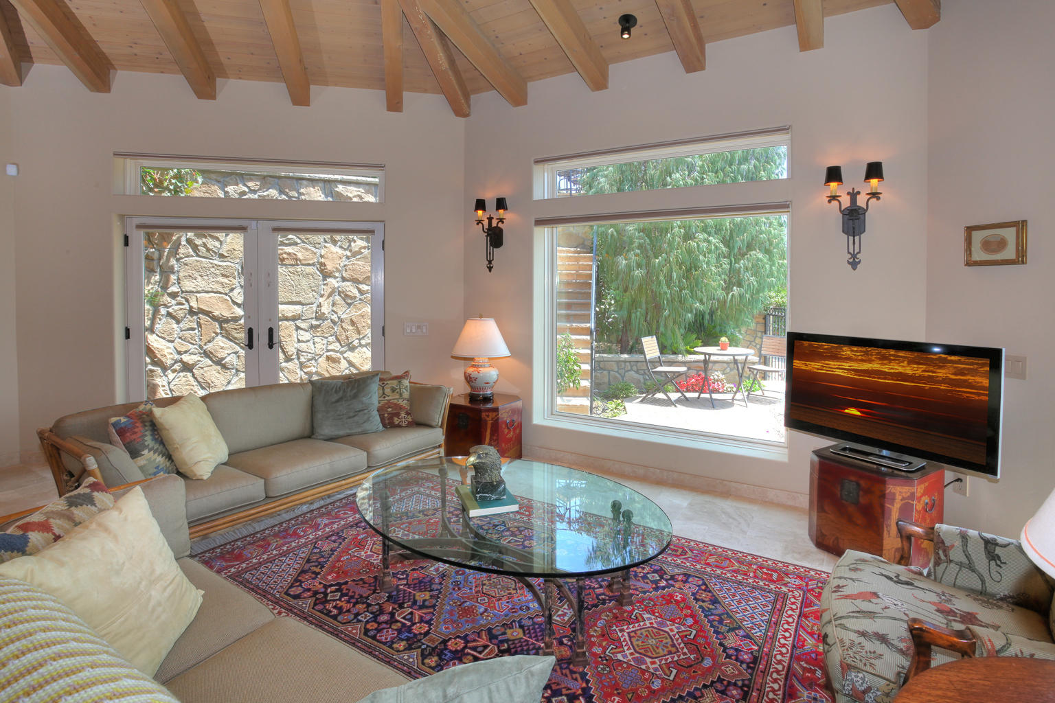 0 Brooktree Road Montecito, CA 93108 - Photo 6 of 13 a living room with furniture a flat screen tv and a large window