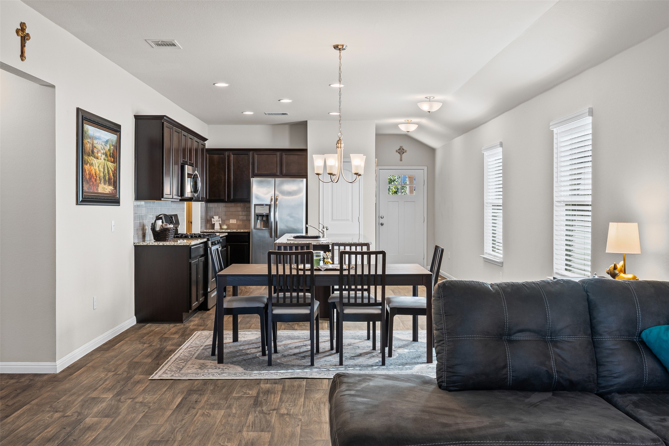 132 Dunlin Lane Leander, TX 78641 - Photo 13 of 34 Dining room featuring dark wood-type flooring, a chandelier, and recessed lighting