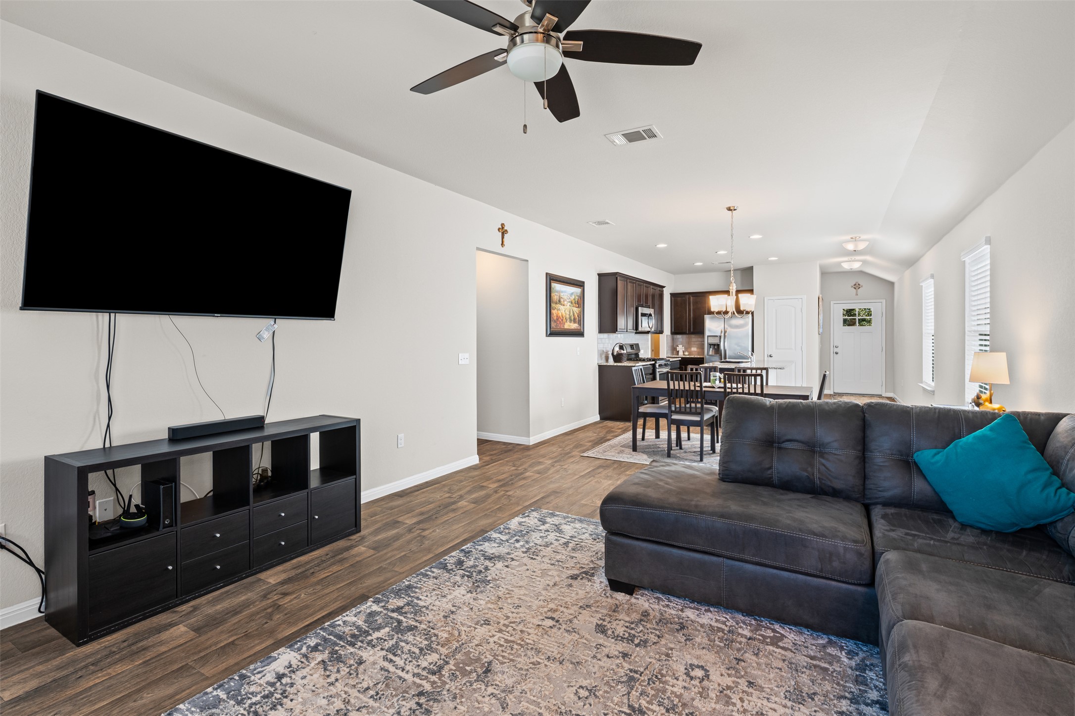 132 Dunlin Lane Leander, TX 78641 - Photo 14 of 34 Living area featuring ceiling fan and dark wood finished floors