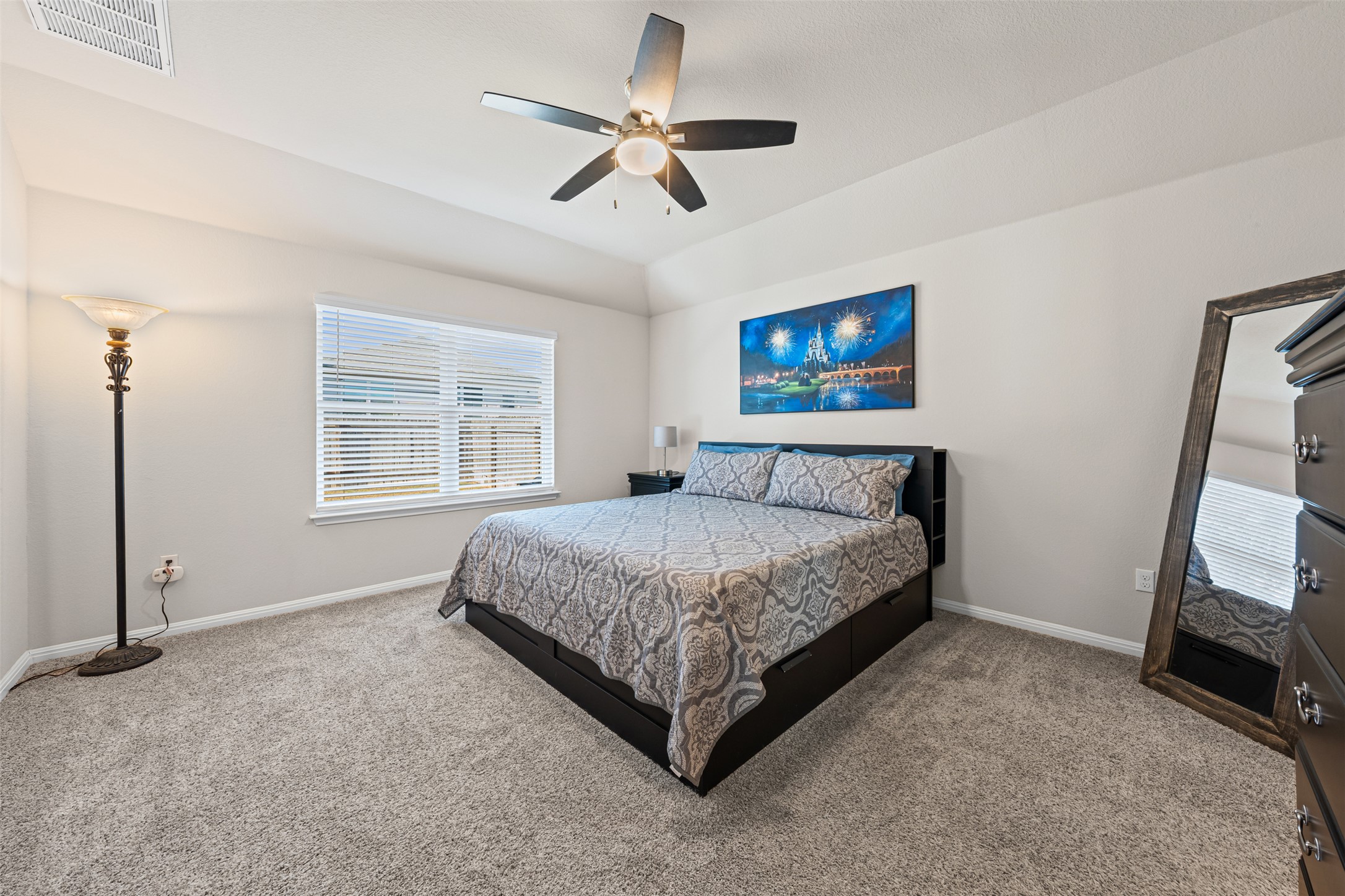 132 Dunlin Lane Leander, TX 78641 - Photo 15 of 34 Carpeted bedroom featuring ceiling fan and vaulted ceiling
