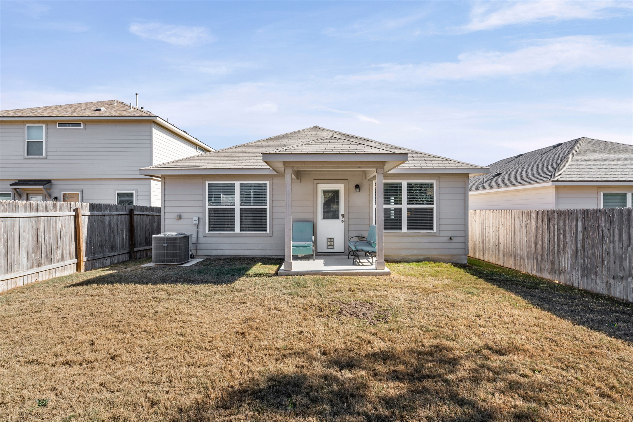 132 Dunlin Lane Leander, TX 78641 - Photo 25 of 34 Rear view of house featuring a patio area and a fenced backyard