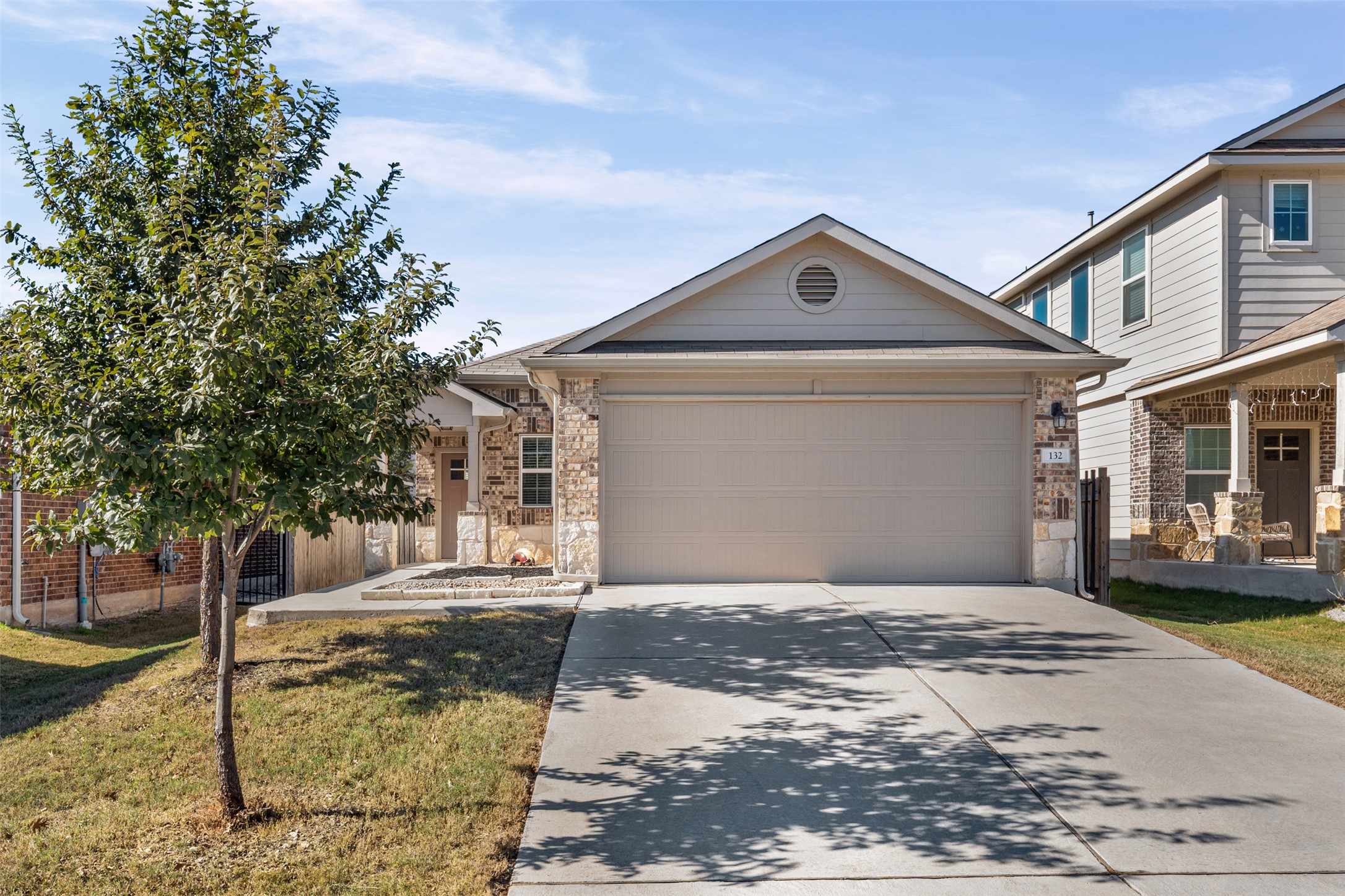 132 Dunlin Lane Leander, TX 78641 - Photo 3 of 34 View of front of home with driveway, an attached garage, and stone siding