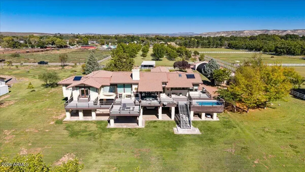 a aerial view of a house with a lake view